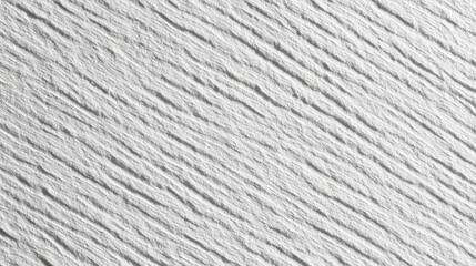 Close-up view of a textured, light gray surface with diagonal lines