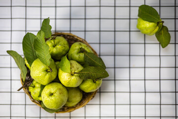 Green Guava In The Bamboo Basket On The Table
