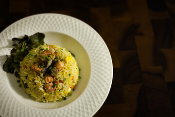 Plate Of Salmon Fried Rice On Rustic Wooden Table