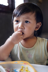 Toddler Is Eating Breakfast By Himself