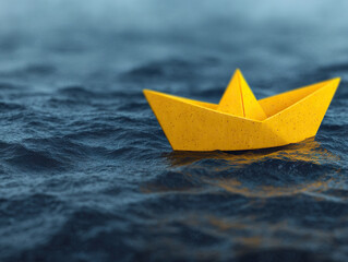 Yellow paper boat floating on rippling water, evoking sense of calm and simplicity