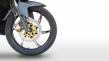 Fototapeta premium disc brake of the front wheel of a sports motorcycle. black motorcycle wheel showcases a sleek design with polished accents. white background