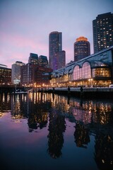 Fototapeta premium City skyline at twilight reflected in water
