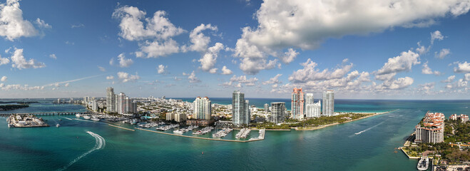 Panoramic view of Miami skyline. Panoramic cityscape of Miami with coastal skyscrapers. Panoramic view of Miami Beach from above. Iconic landmarks line of Miami skyline.