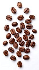 Roasted coffee beans scattered on a white background