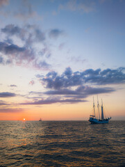 Sunset on the Baltic Sea near the coastal town of Warnemünde (Rostock) during the maritime event...