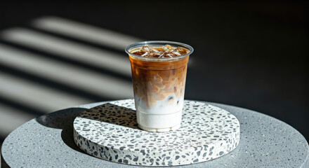Iced Coffee Drink with Milk on Round Terrazzo Table