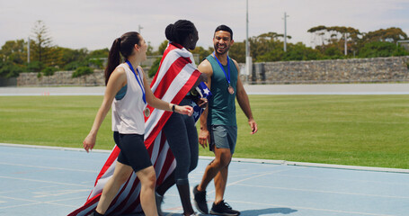 Team, athlete and USA flag on track, women and man with celebration, medal and success at competition. People, group and national pride for goals, achievement and winner at global sports event