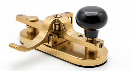 A pristine vintage telegraph key, crafted from polished brass with a classic black knob, isolated on a clean white background.