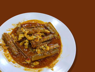 A plate of bamboo clams or razor clams cooked with Padang sauce. Seafood from Indonesia.
