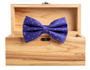 Purple Polka Dot Bow Tie on Wooden Box with Warm Lighting PNG