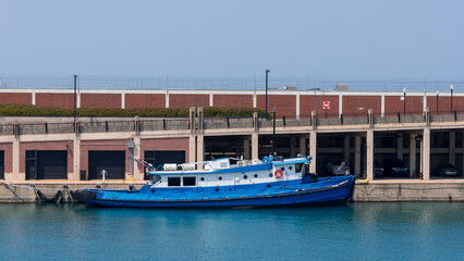 Single Blue US coast guard boat on Lake Michigan by Navy Pier in Chicago, Illinois, USA