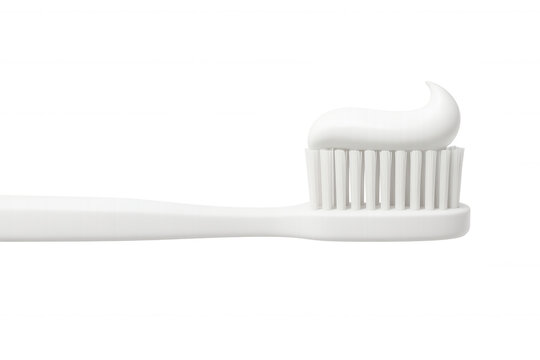 Clean white toothbrush with sparkling toothpaste coating, highlighting daily dental care against crisp minimalist transparent backdrop