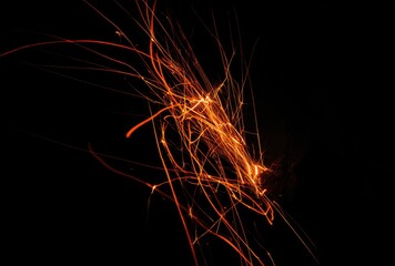 Abstract fiery streaks against black