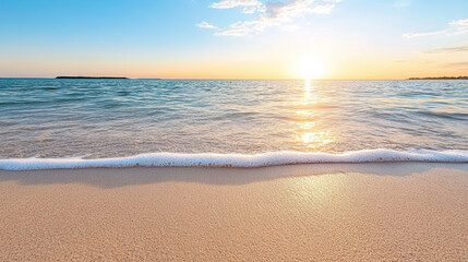Obraz premium Golden hour sunset over calm ocean waves gently lapping sandy beach, creating serene atmosphere