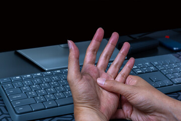 Work-related hand pain from repetitive strain—tendon, nerve, and muscle injury caused by prolonged computer use. Office ergonomics and RSI awareness. Office syndrome.