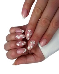 Young Woman’s Hands with Luxurious Professional Manicure Featuring Elegant Nail Art, Glossy...