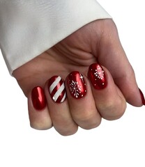 Young Woman’s Hands with Luxurious Professional Manicure Featuring Elegant Nail Art, Glossy...