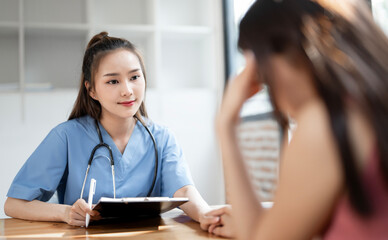 A medical professional, possibly a nurse or doctor, is seen smiling while consulting with a patient...