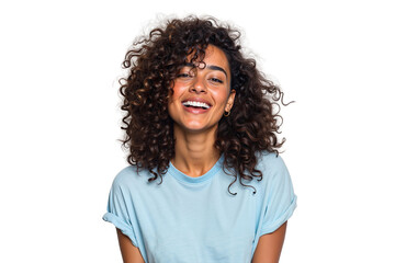 Happy young woman with curly brown hair laughing joyfully. Cheerful and natural female beauty with a genuine smile in a studio shot