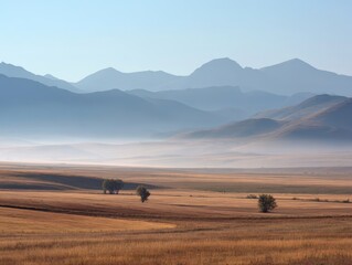 Obraz premium Open Steppe Landscape with Distant Mountains and Thin Mist