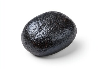 Dark, smooth, oval-shaped stone on white