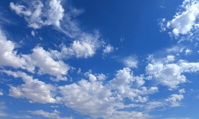 Fototapeta premium Vast blue sky dotted with fluffy white clouds (1)
