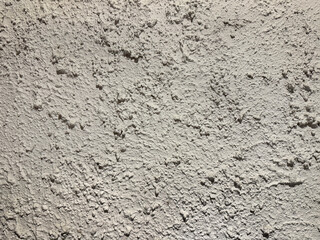 Decorative white textured paint on a wall or panel. White washed paint with random grunge, and dirt pattern. Seamless background texture.