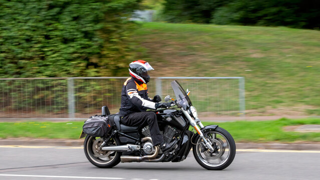 Milton Keynes,Bucks,UK - Aug 3rd 2025: man riding a Harley Davidson v-rod  motorcycle travelling on a British road