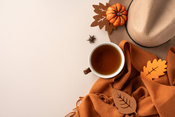 A cozy composition featuring a cup of tea, autumn leaves, and warm seasonal decor, emphasizing the...