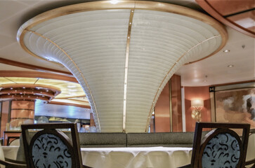 Formal and elegant ocean view dining room restaurant onboard luxury cruiseship or cruise ship liner...