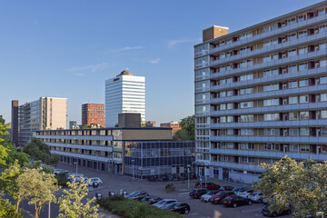 Modern residential and office buildings under clear blue sky in an urban area. Contemporary...