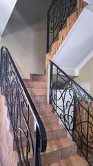 Stone steps and forged railings. Staircase to the second floor in the house.