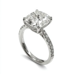 A cushion cut diamond engagement ring with a diamond band