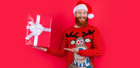 cheerful man with christmas present. merry christmas. santa man hold christmas present
