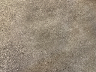 Close up of concrete washed cement texture with brush stroke, grunge, and dirt pattern. Suitable for wall and floor finishes. Seamless background texture.