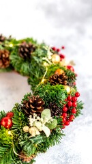 Festive Christmas wreath with greenery, pine cones, and berries
