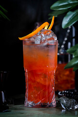 Rose lady, low alcoholic cocktail drink with cider, cranberry and orange juice with bar tools