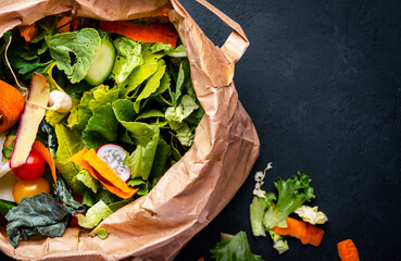 Kitchen food waste in recyclable paper bag for compost. Sustainable lifestyle, plastic free....