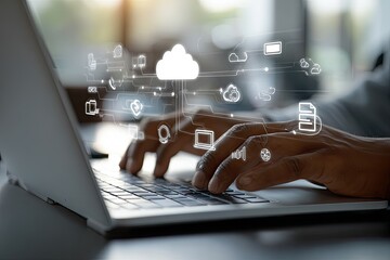 Hands typing on a laptop with cloud computing graphics overlay