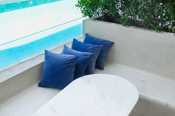 Empty swimming pool with table and chairs in summer,sofa resort neary sea and beach,restaurant and...