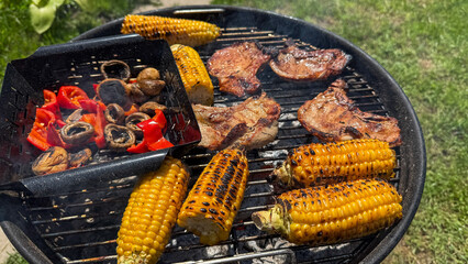 Grilled corn and sizzling meats dance on a smoky altar, celebrating the fiery spirit of Barbecue Week and Lughnasadh