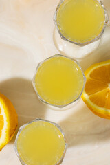 Citron nectar in crystal glasses, echoing golden sunrise rituals, citrus solstice, and Mediterranean zestful gatherings