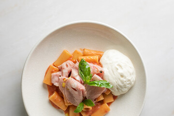 Creamy burrata whispers against vibrant tomato pasta and tender turkey, embodying culinary fusions...