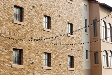 Modern Condominium and apartment building red brick wall in the city downtown,Residential Building on sky background.