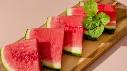 Juicy watermelon slices with mint leaves, exuding summertime solstice freshness, vibrant picnic delight, National Watermelon Day celebration