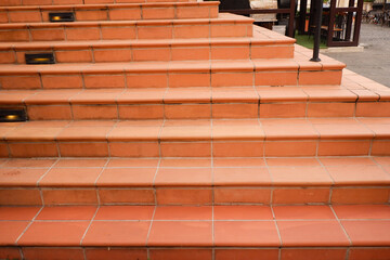 Stairs in the city,Granite stairs and red brick wall,Stone stairway Modern,concrete stairs outside,Empty modern building composition.