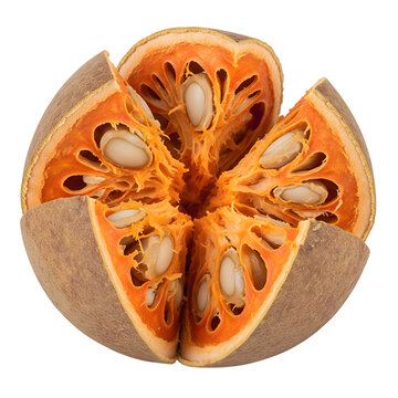 Half cut ripe wood apple fruit showing juicy orange pulp and seeds isolated on transparent background