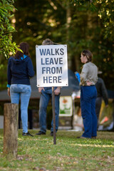 sign saying walks leave from here