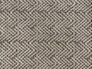 Close up of upholstery fabric in chevron pattern, in grey and white color. horizontal chevron pattern seamless background texture.